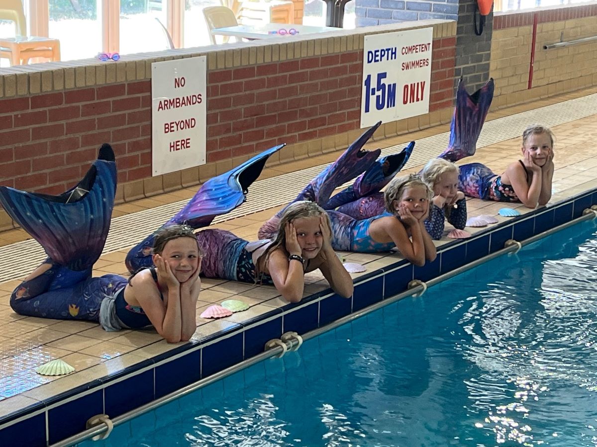 kids mermaid session in swimming pool