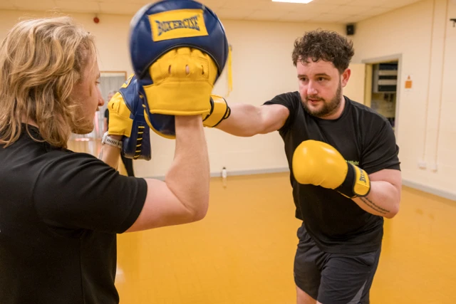 Boxercise (6) Two male class members taking part in boxercise session
